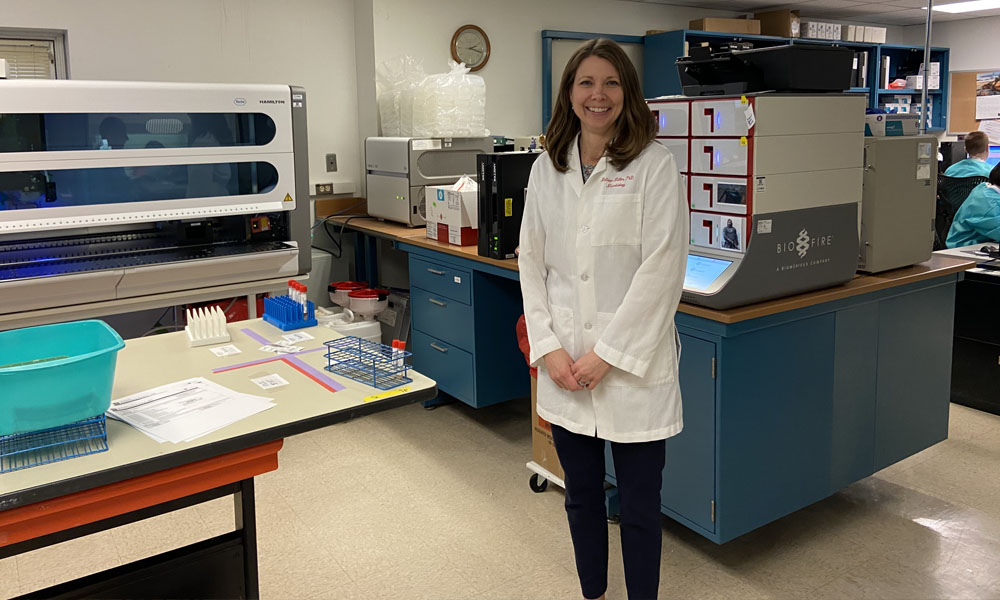 Dr. Melissa Miller stands in a lab